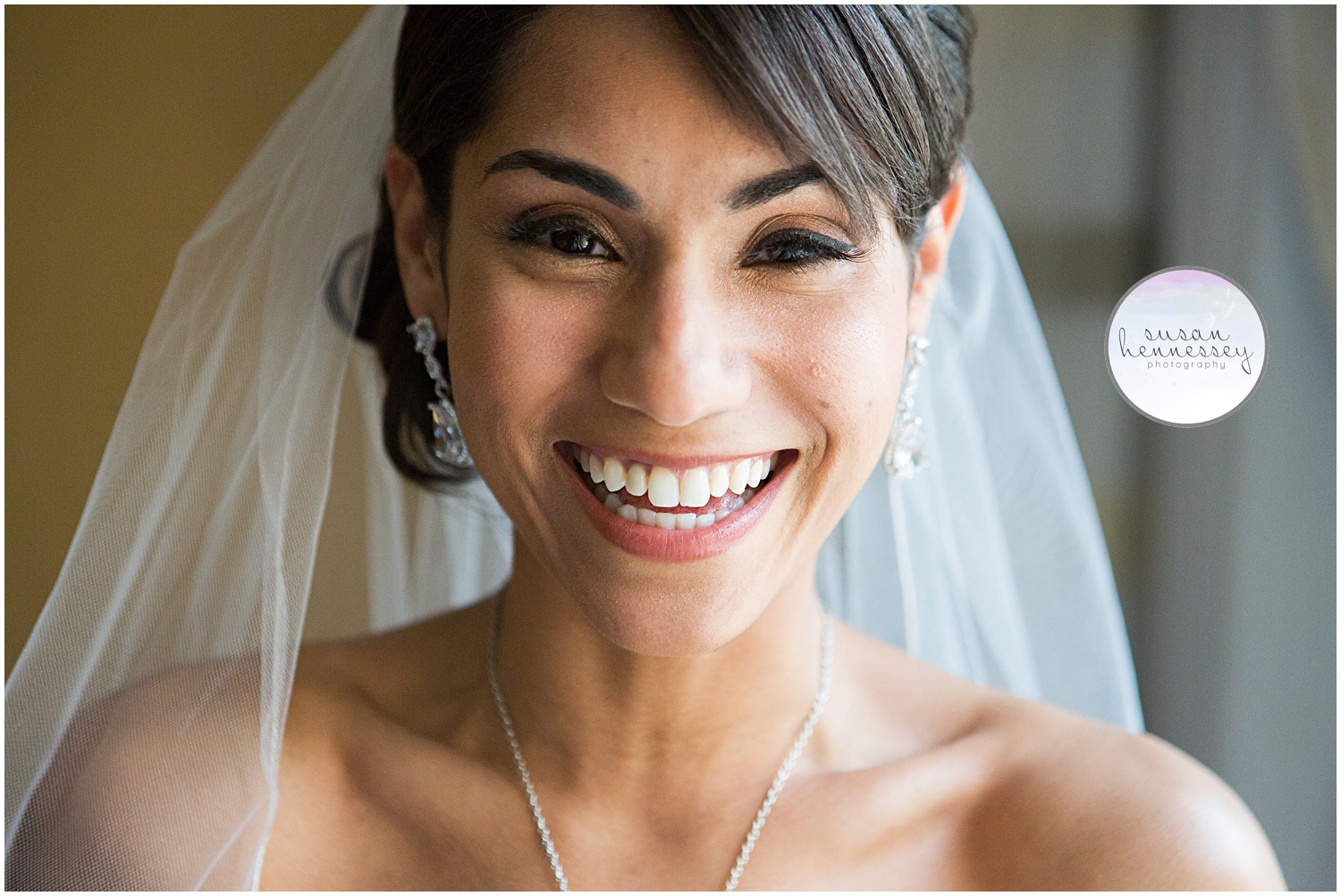 Happy bride smiling on her wedding day. 