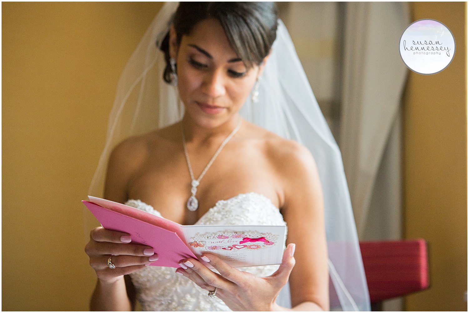 Bride reads an emotional card from her groom on their wedding day.