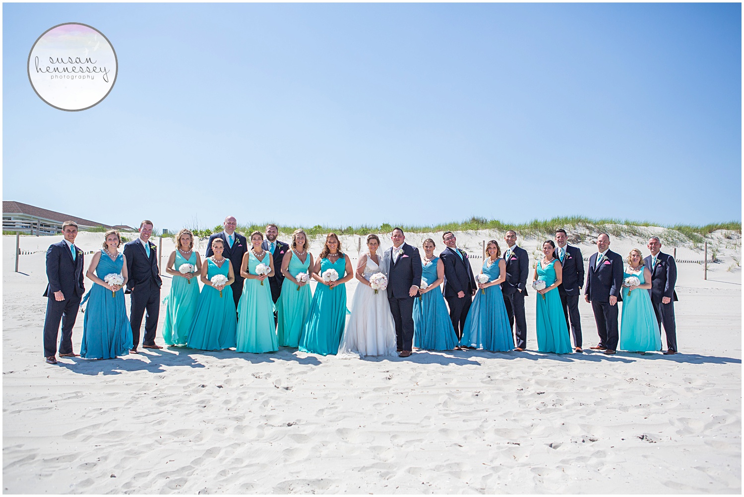 Bridal party pose on beach