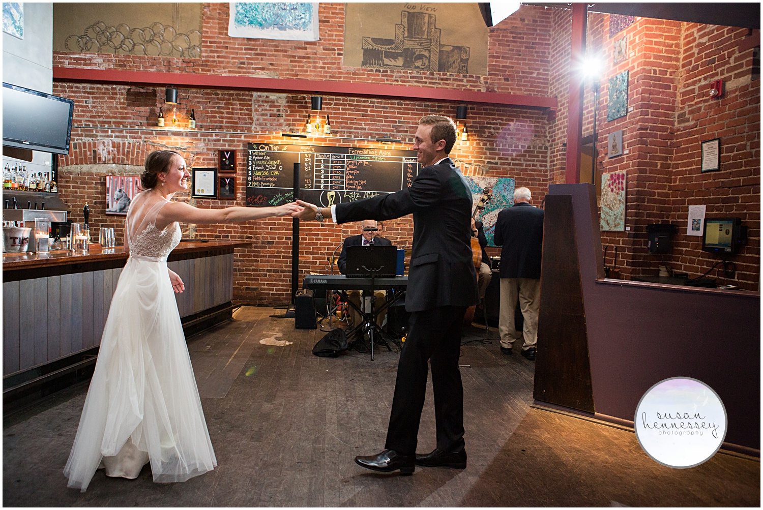 Bride and groom dance at their Triumph Brewery wedding