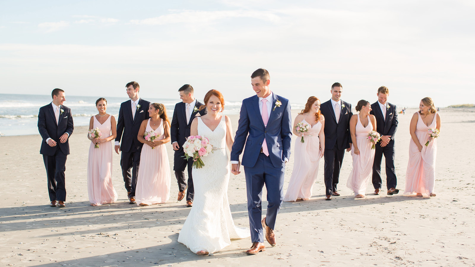 Bridal party on the beach at the Jersey Shore - Photography by Susan Hennessey Photography, a South Jersey wedding photographer