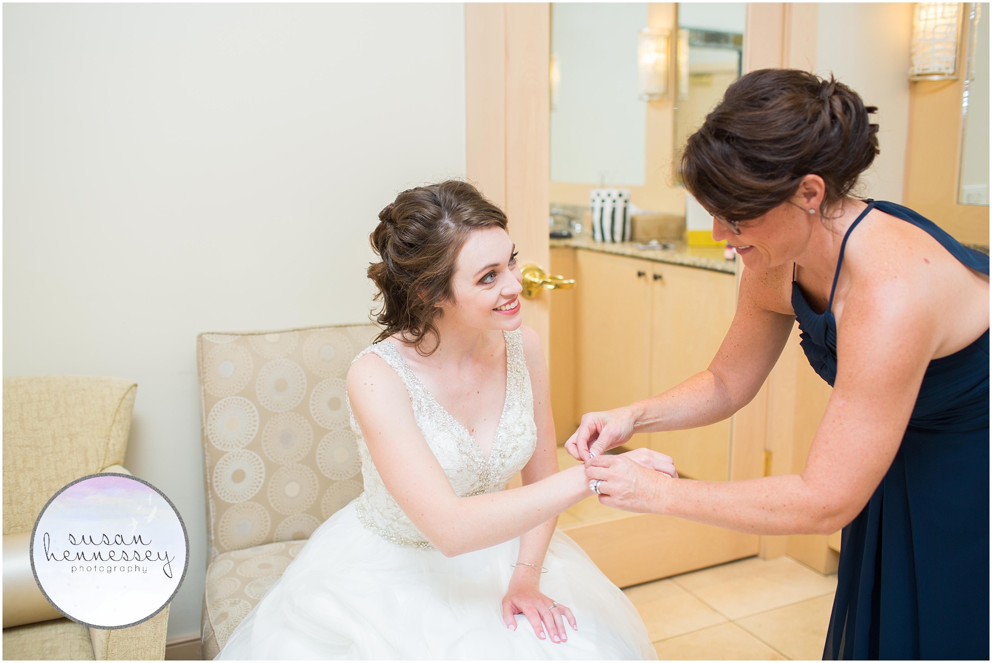 finishing touches of jewelry at the Madison Wedding