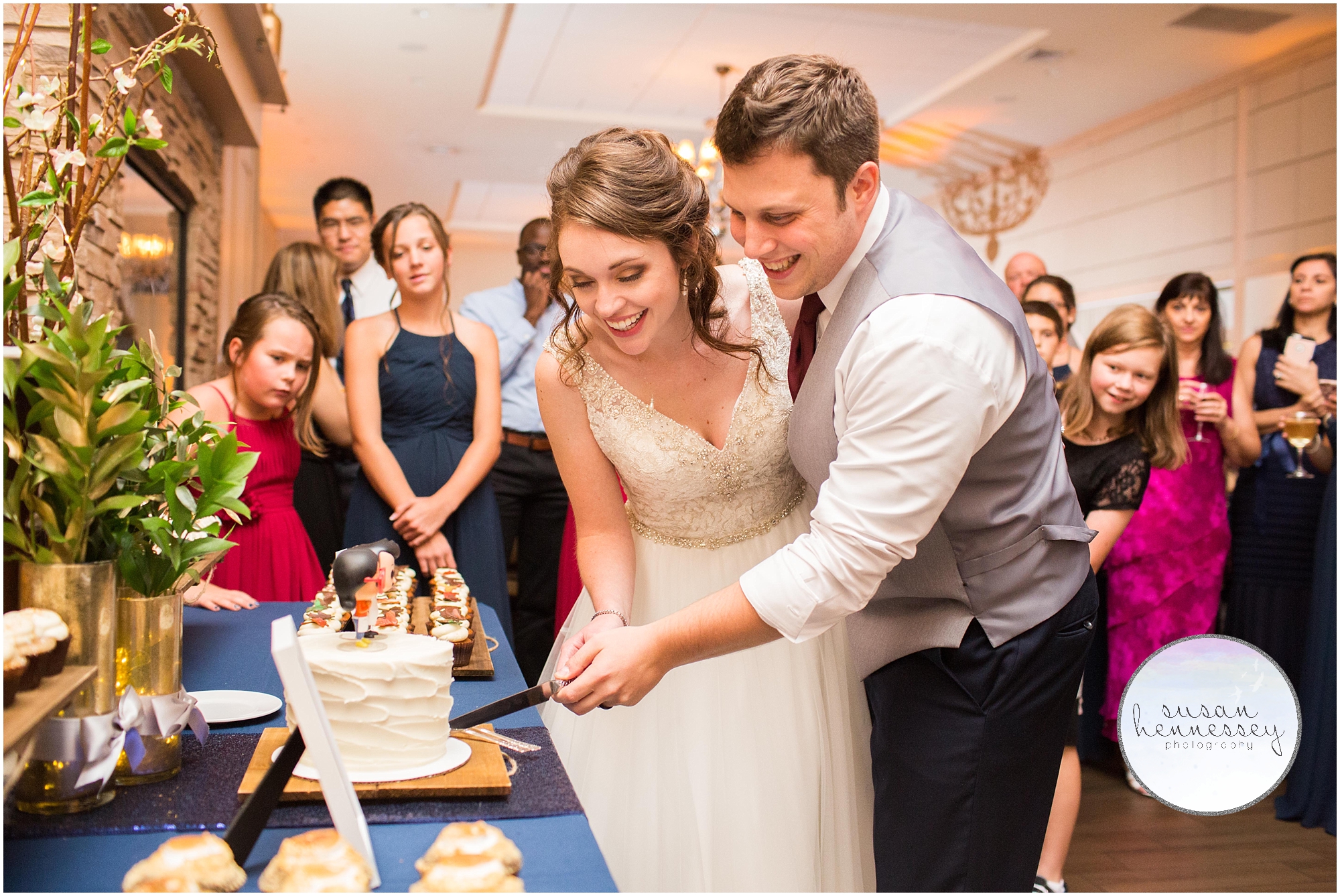 newlyweds cutting the cake at the Madison Wedding 