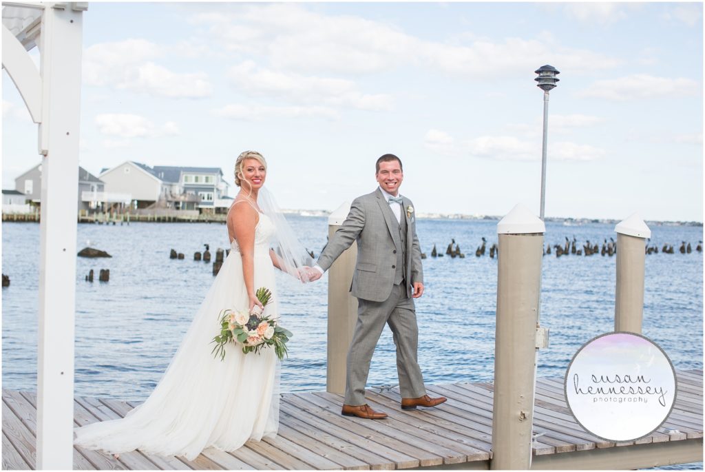 Bride and groom on dock at Martell's Waters Edge