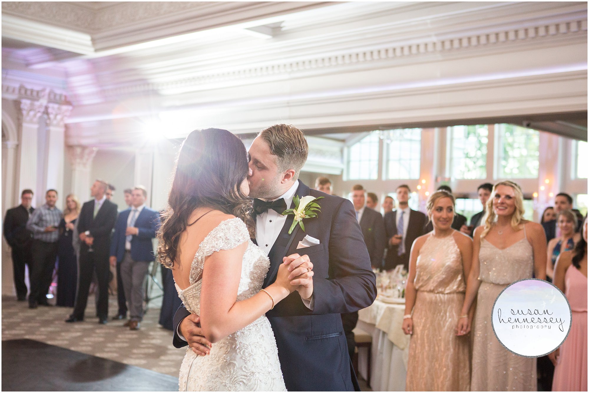 Bride and groom share a kiss during their first dance as husband and wife!