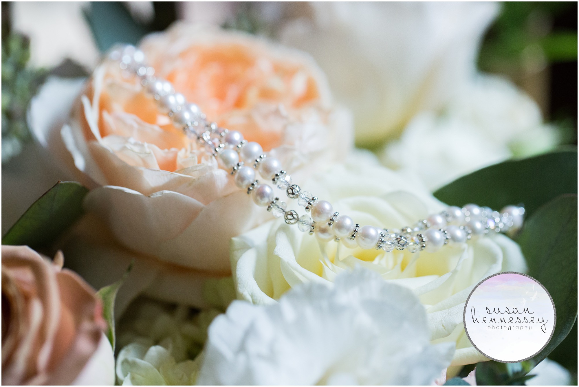 Bride's bracelet and bouquet on wedding day.
