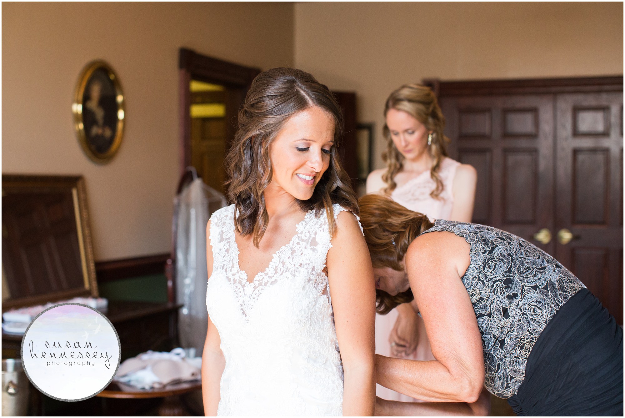 Bride gets dressed at the Old York Country Club in Chesterfield, New Jersey.
