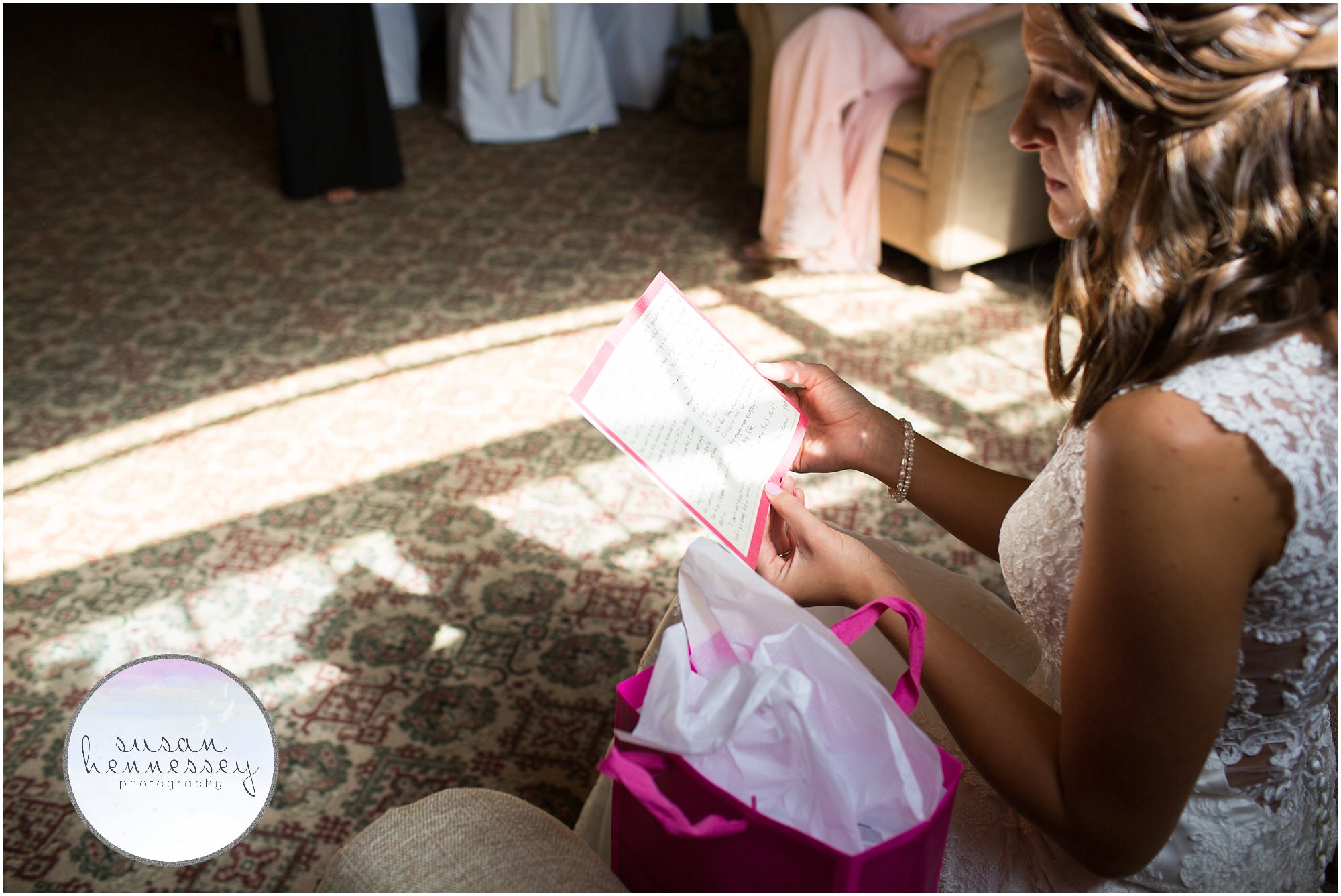 Bride reads card from groom before their first look.