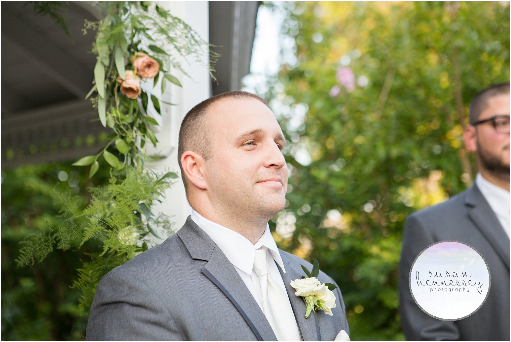 Groom waits for bride to walk down the aisle.