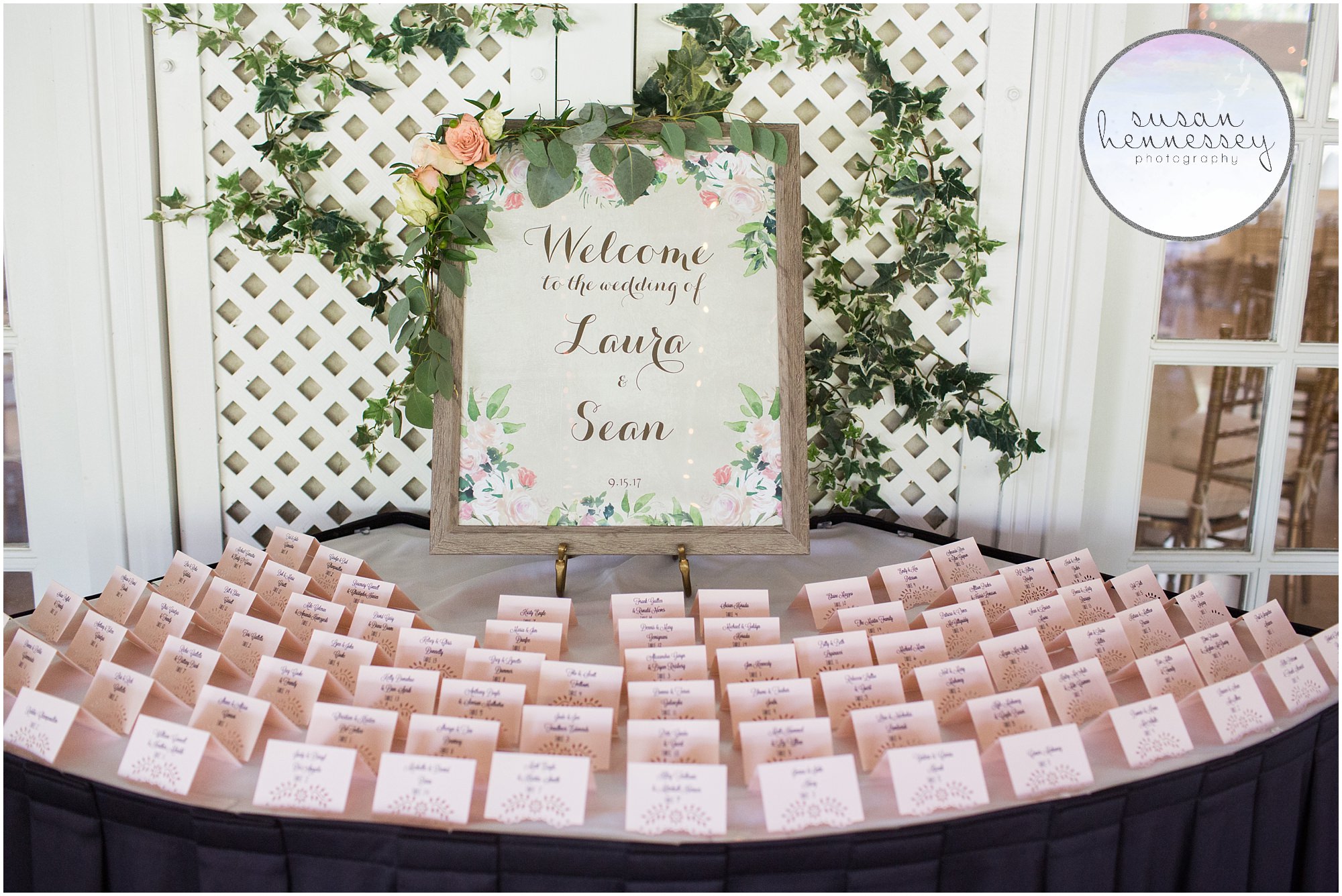 Escort cards and welcome sign at Old York Country Club wedding