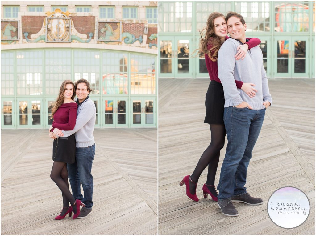 A happy couple at their winter engagement session on the boardwalk at Asbury Park