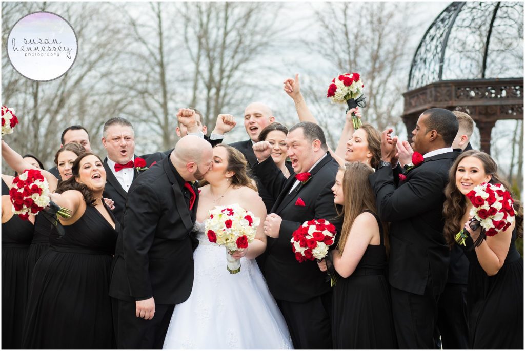 Happy bridal party cheering for bride and groom at The Gramercy at Lakeside Manor in Hazlet, New Jersey