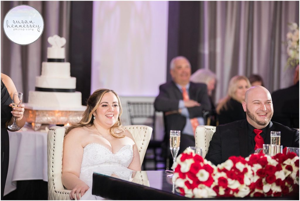 Couple laugh during speeches at their The Gramercy at Lakeside Manor Wedding