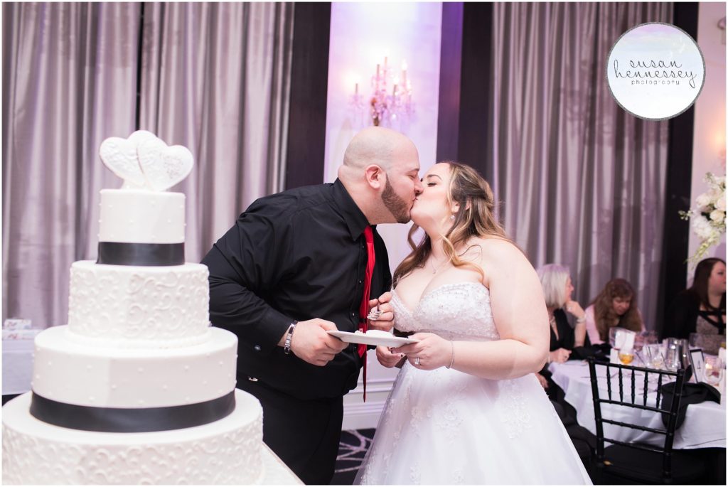 Bride and groom cut their cake at their The Gramercy at Lakeside Manor Wedding