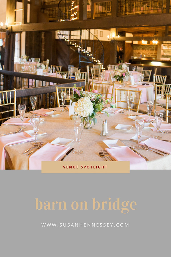 Table and centerpieces at Barn on Bridge Rustic Wedding Venue in Collegeville, PA
