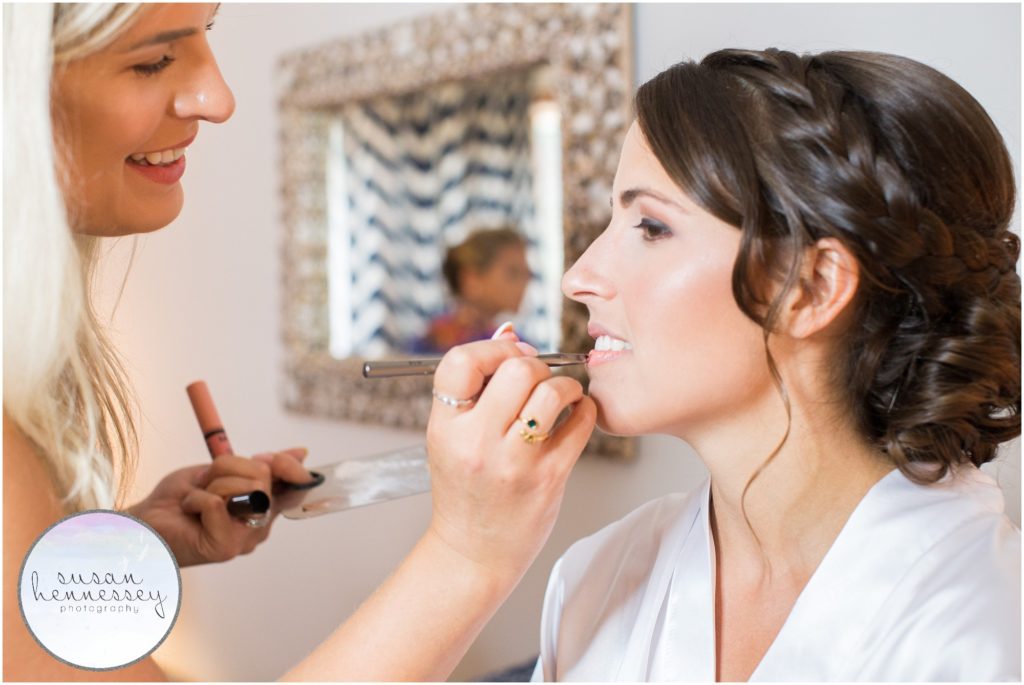 Bride receives final hair and makeup on her wedding day