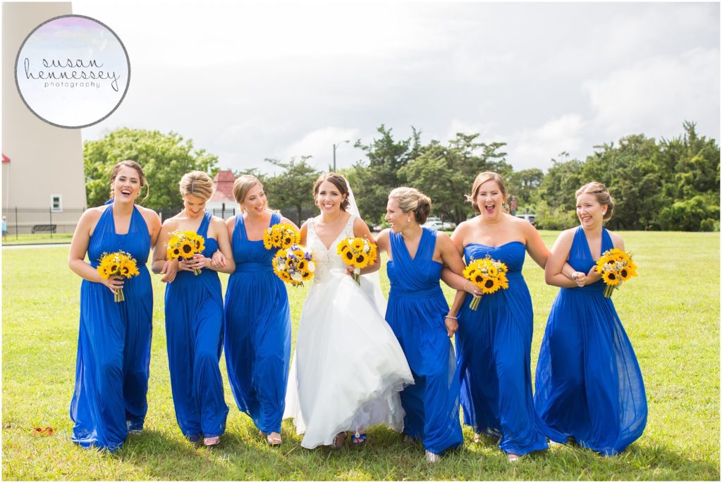 Happy bridesmaids in blue at Cape May light house