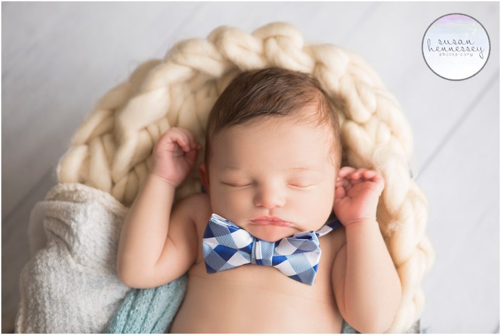 Newborn boy wears bow tie during his Newborn Photo Session