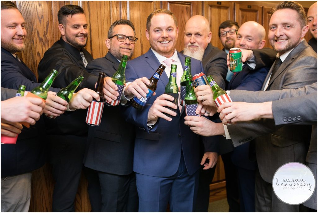 Groom and friends cheer beer before the first look.