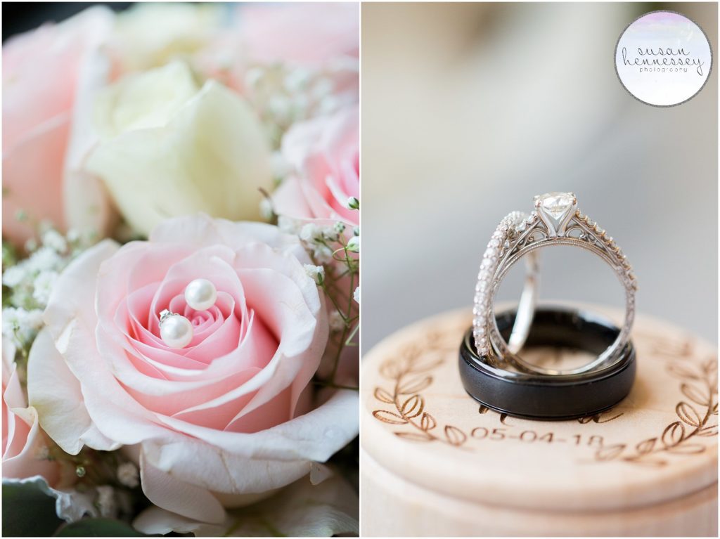 Bride's details on wedding day, ring box, wedding bands and earrings.