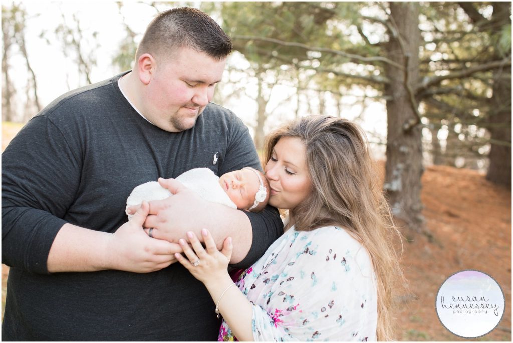 First time parents cuddle their baby girl in their Newborn Photography NJ Session