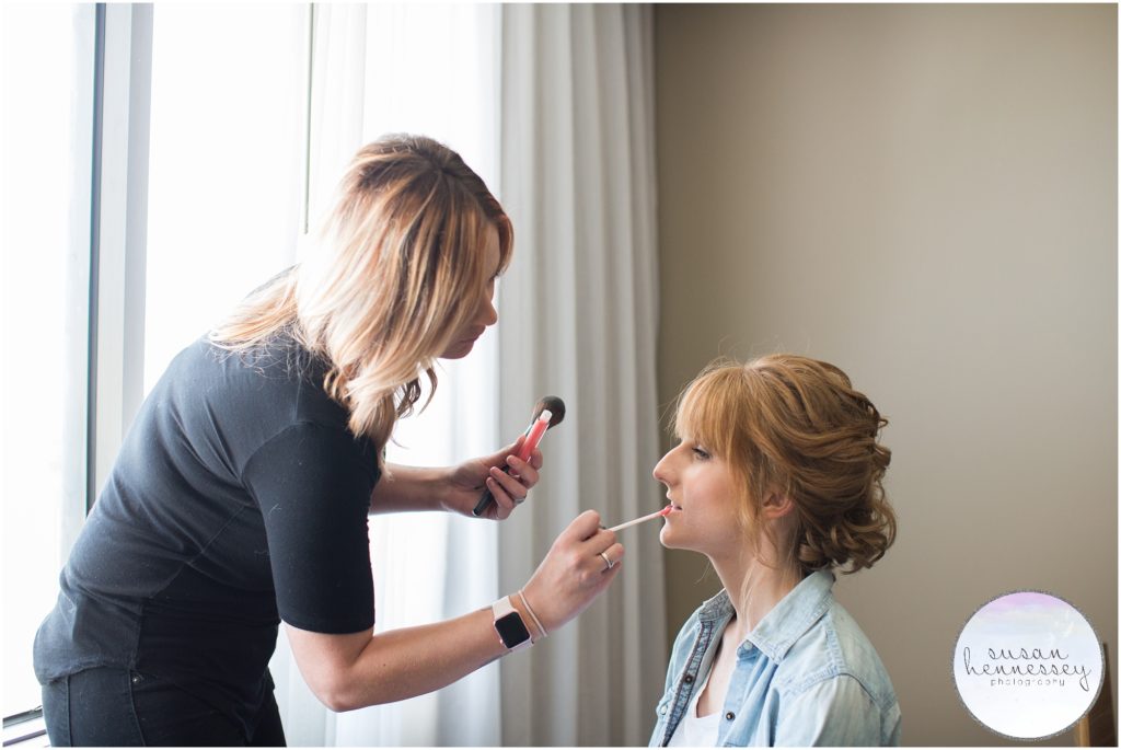 Bride receives final hair and makeup at windrift hotel avalon nj wedding
