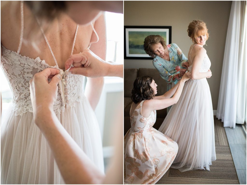 Bride gets buttoned into her wedding gown on the wedding day