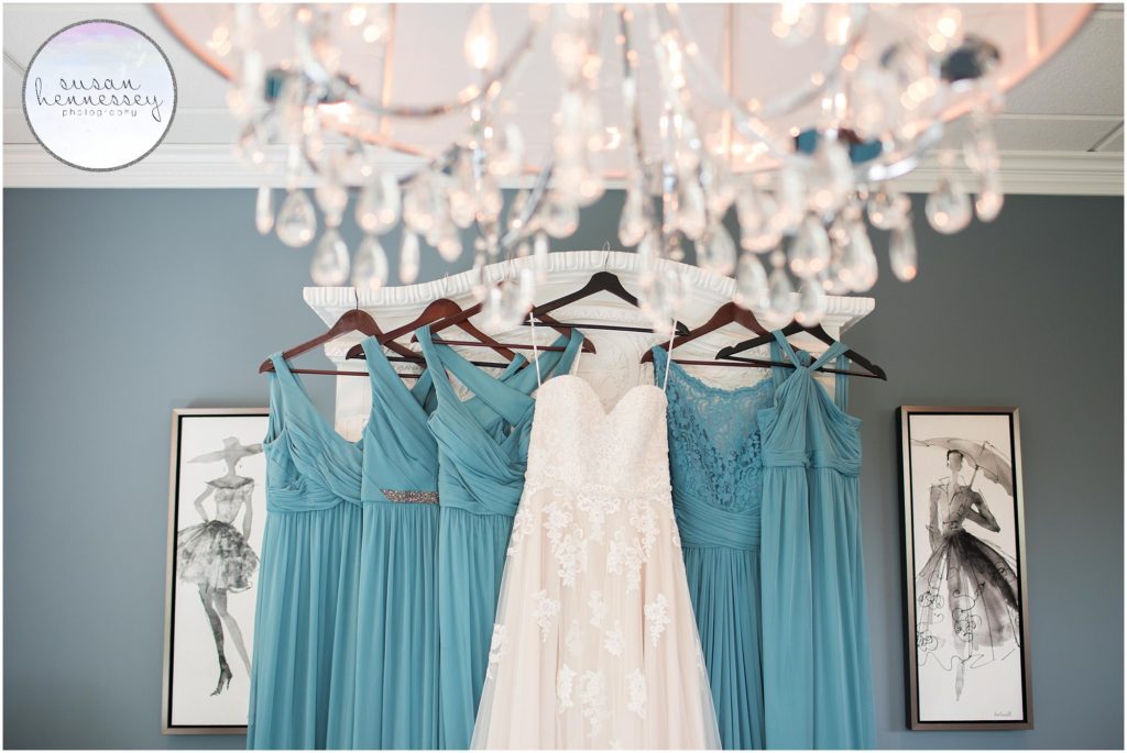 Wedding gown and bridesmaid dresses hanging at the Bradford Estate