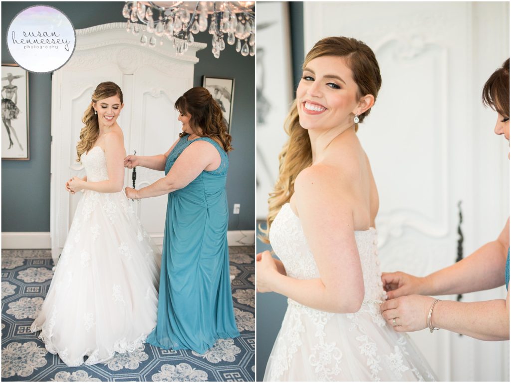 Bride dresses in her Stella York wedding gown