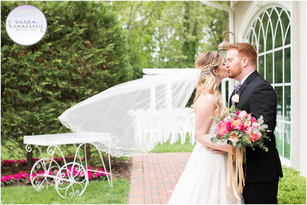 Bride's veil blows in the wind at Spring wedding
