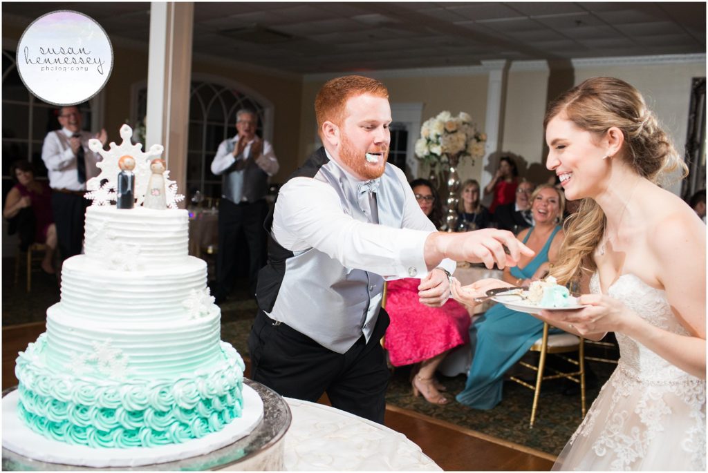 Bride and groom cut cake at the Bradford Estate wedding reception