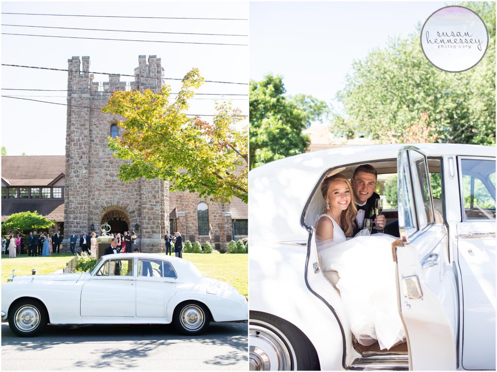 Bride and groom in vintage car on their wedding day