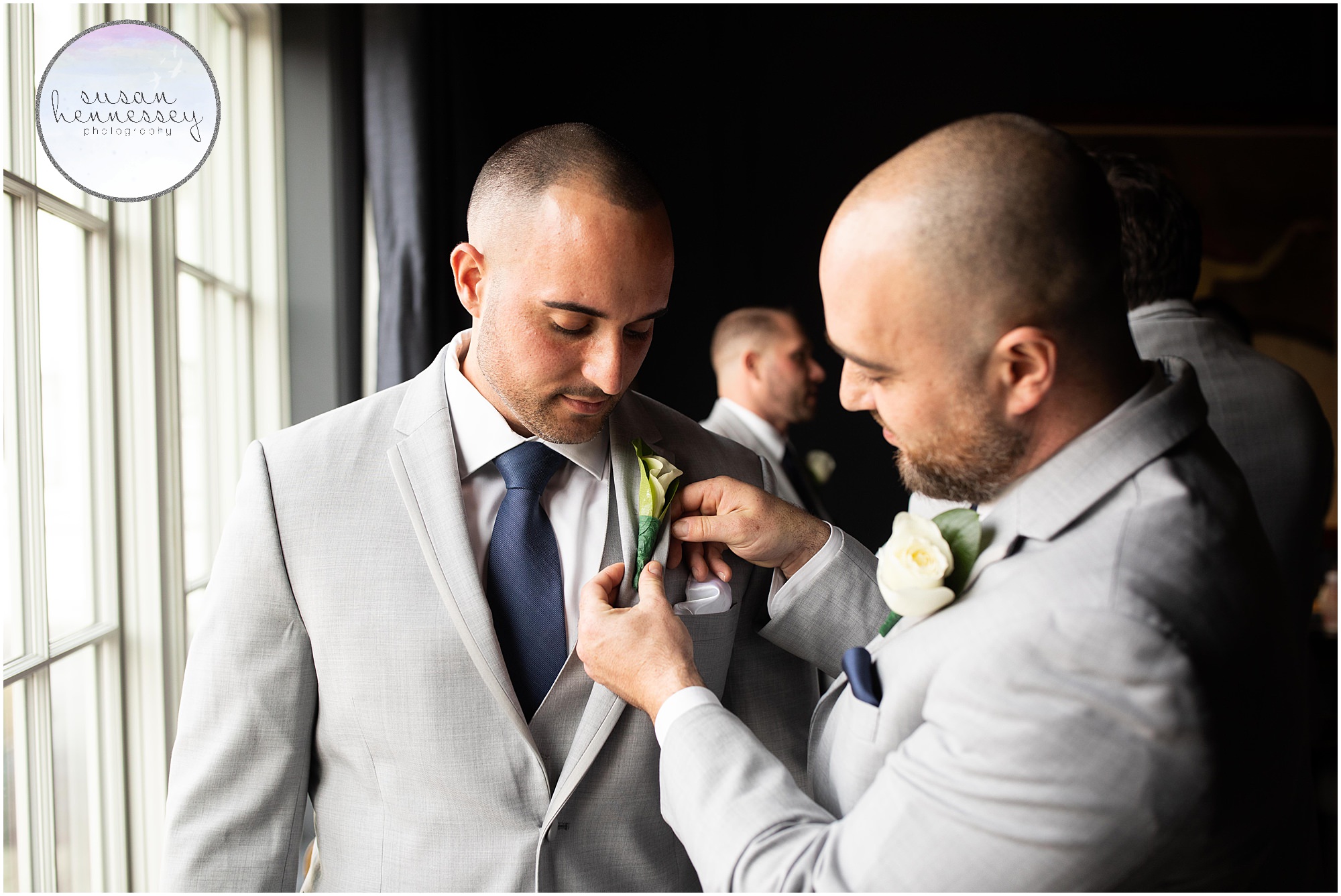putting the boutonnieres on