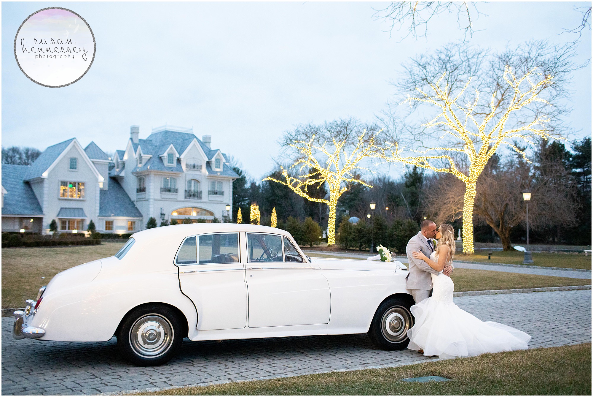 A bride and groom and their vintage rolls royce.