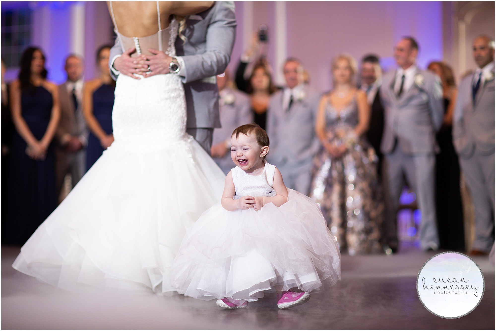 Toddler steals the show during bride and groom's first dance.