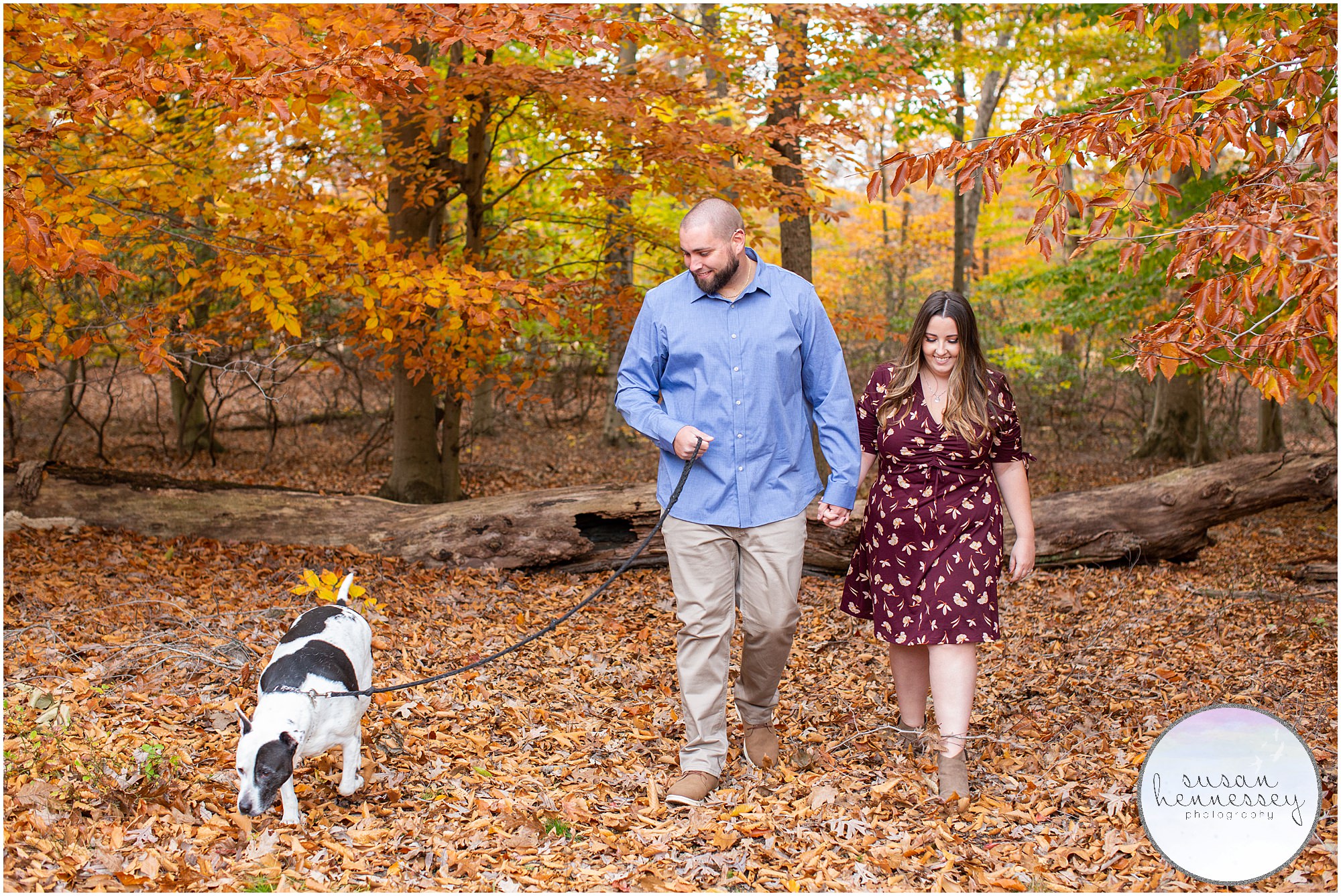 An engaged couple and their dog.