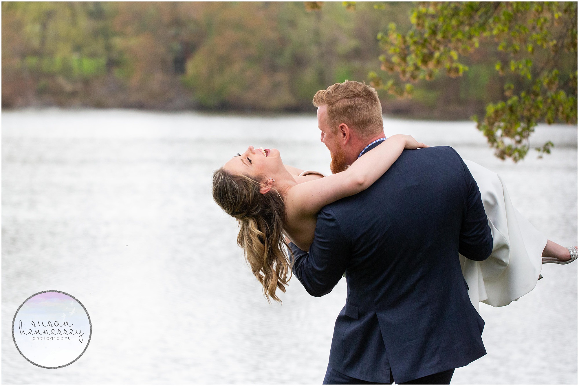 A bride and groom in front of lake at Indian Trail Club