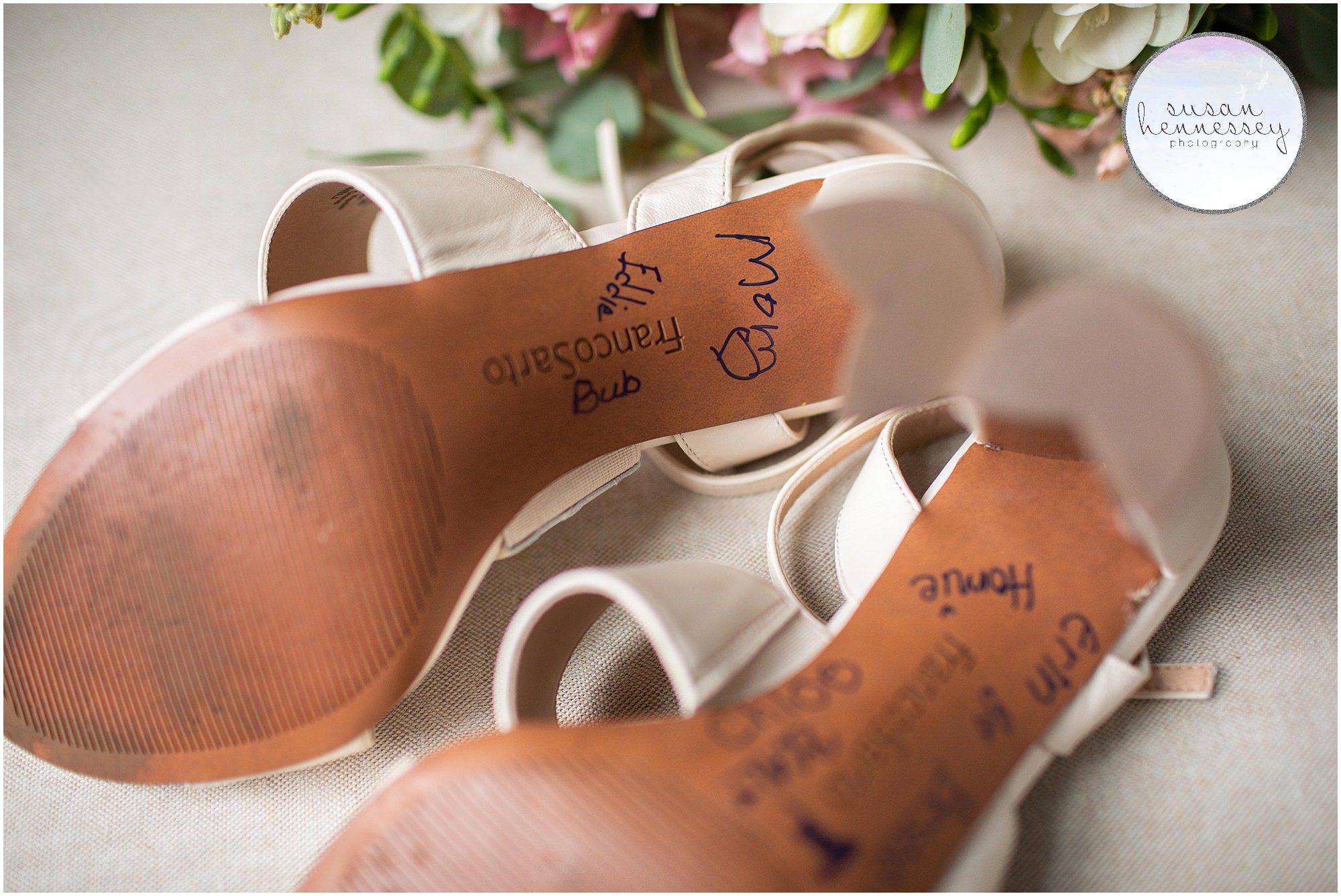 The bride's family and bridesmaids sign bottom of shoe as her "something blue".