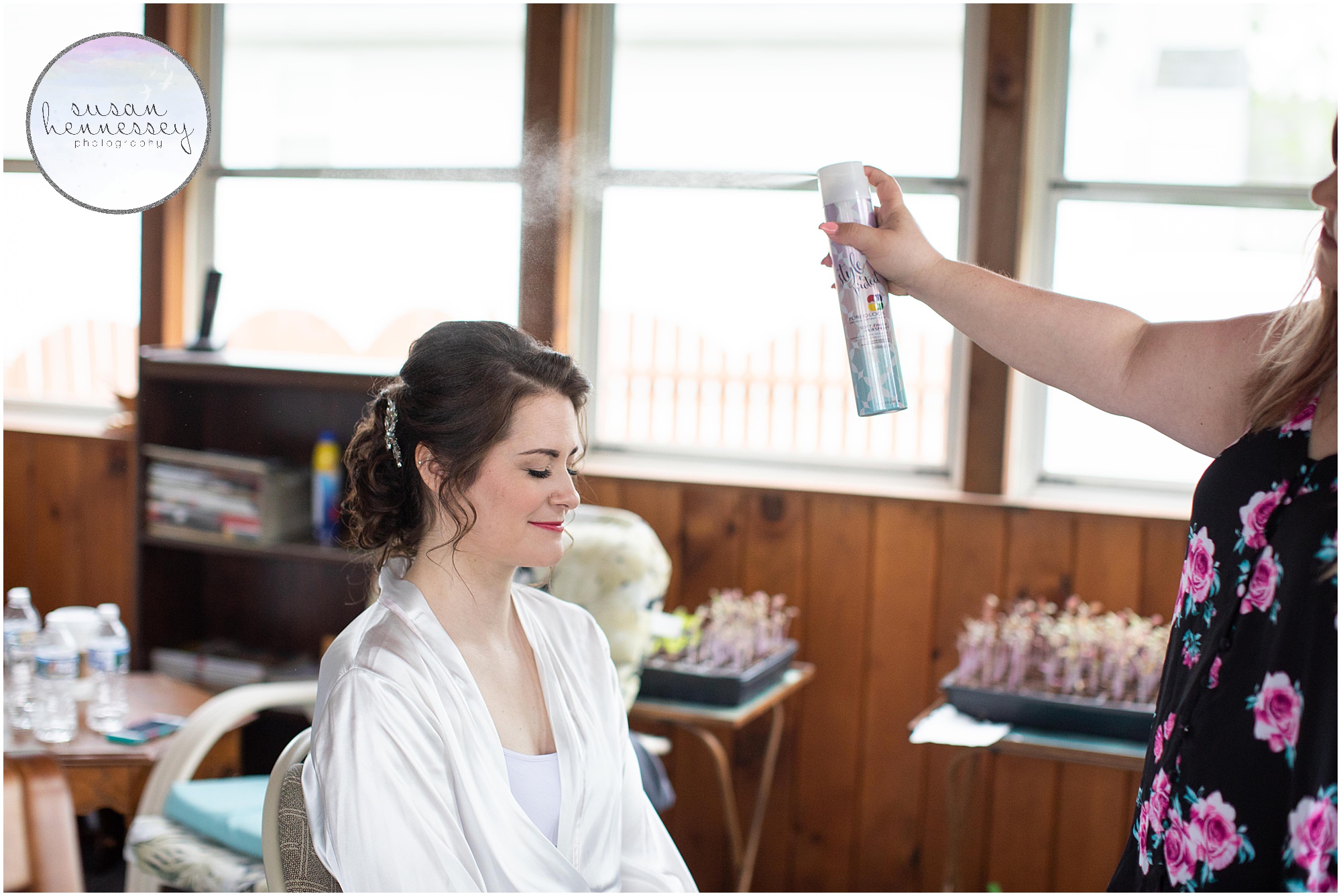 Bride receives final hair on her wedding day. 