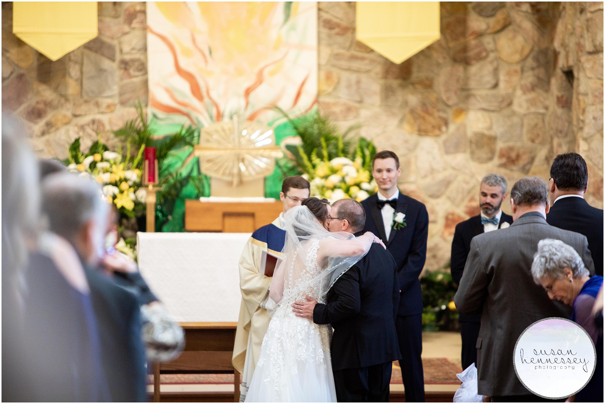 Father gives bride away at Spring wedding.