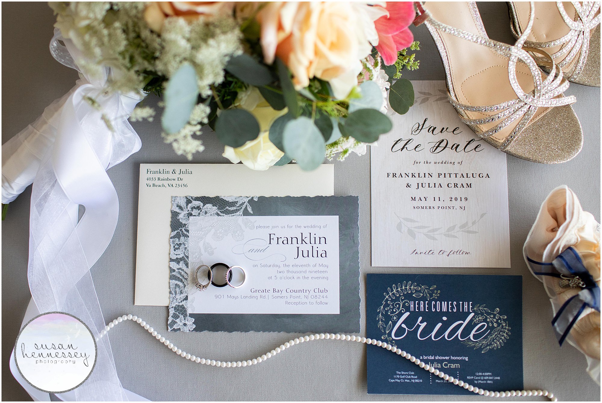 Bridal details featuring invitation, wedding bands, pearl necklace, garter and shoes.