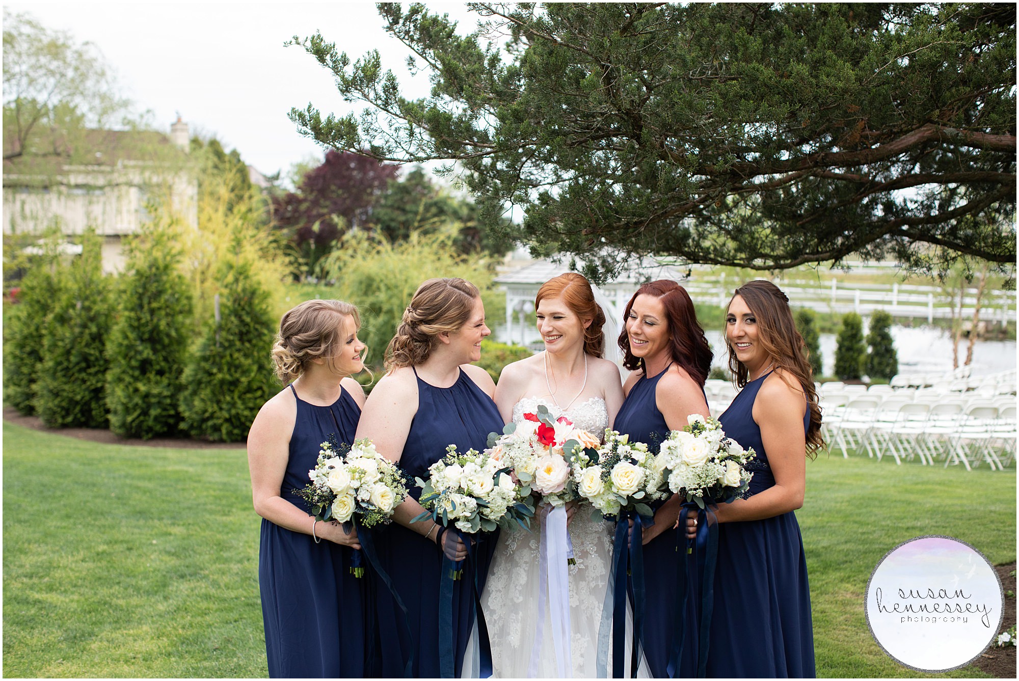 A bride and her briesmaids laughing. 