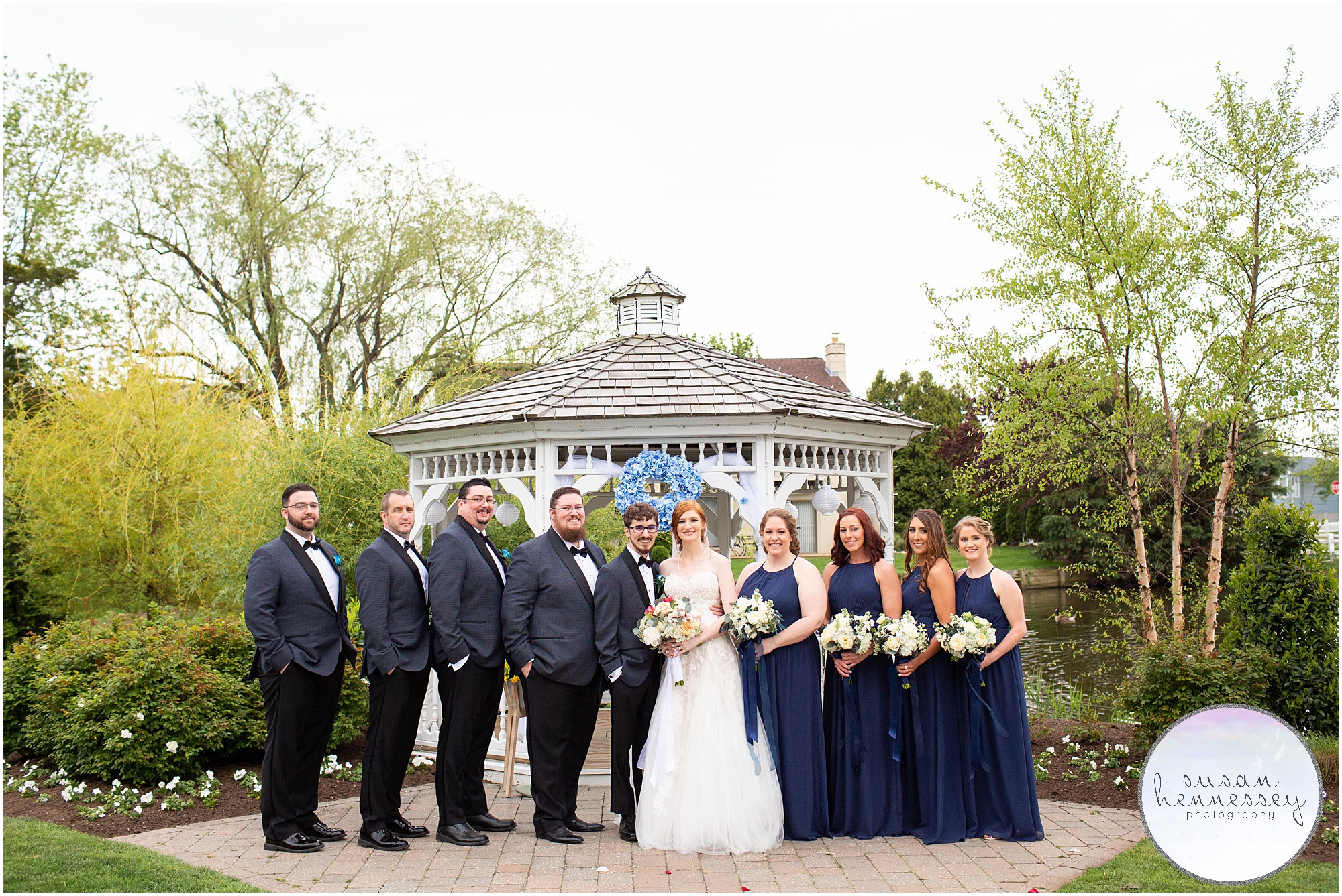 Bridal portraits with bridesmaids in navy blue.