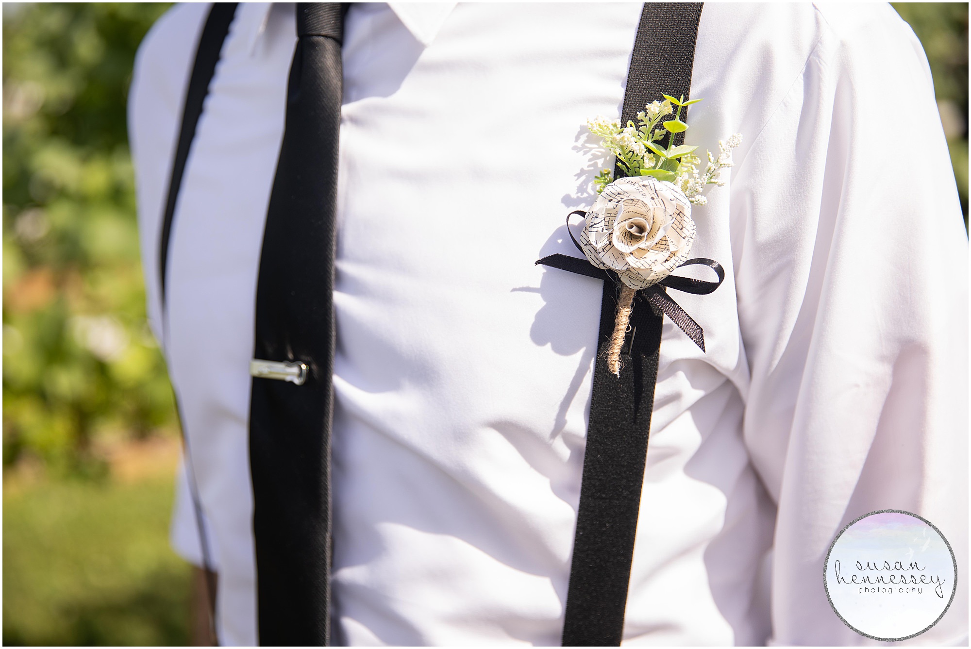 Detail of groom's music themed boutonniere. 