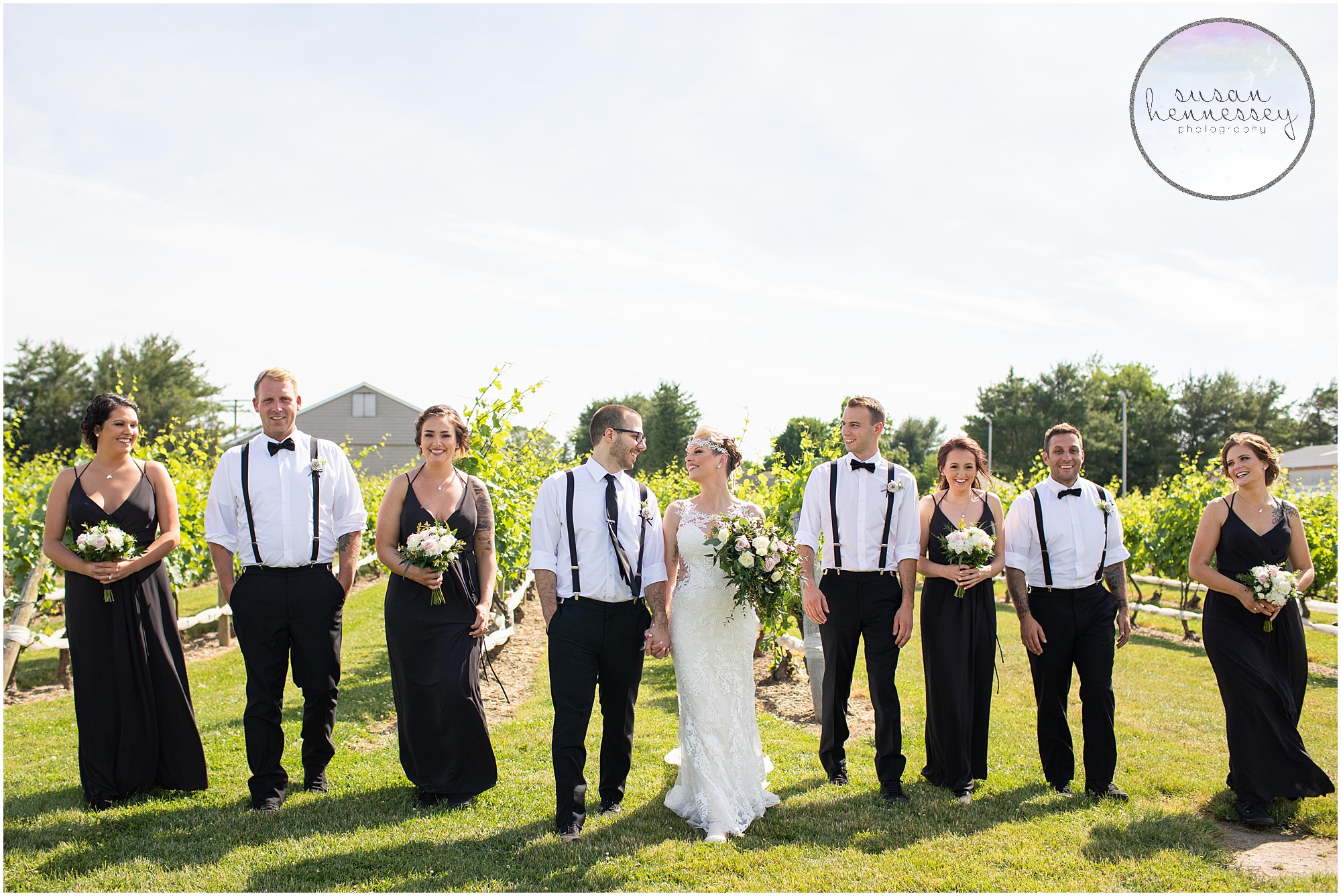 Bridal party in black at vineyard wedding.
