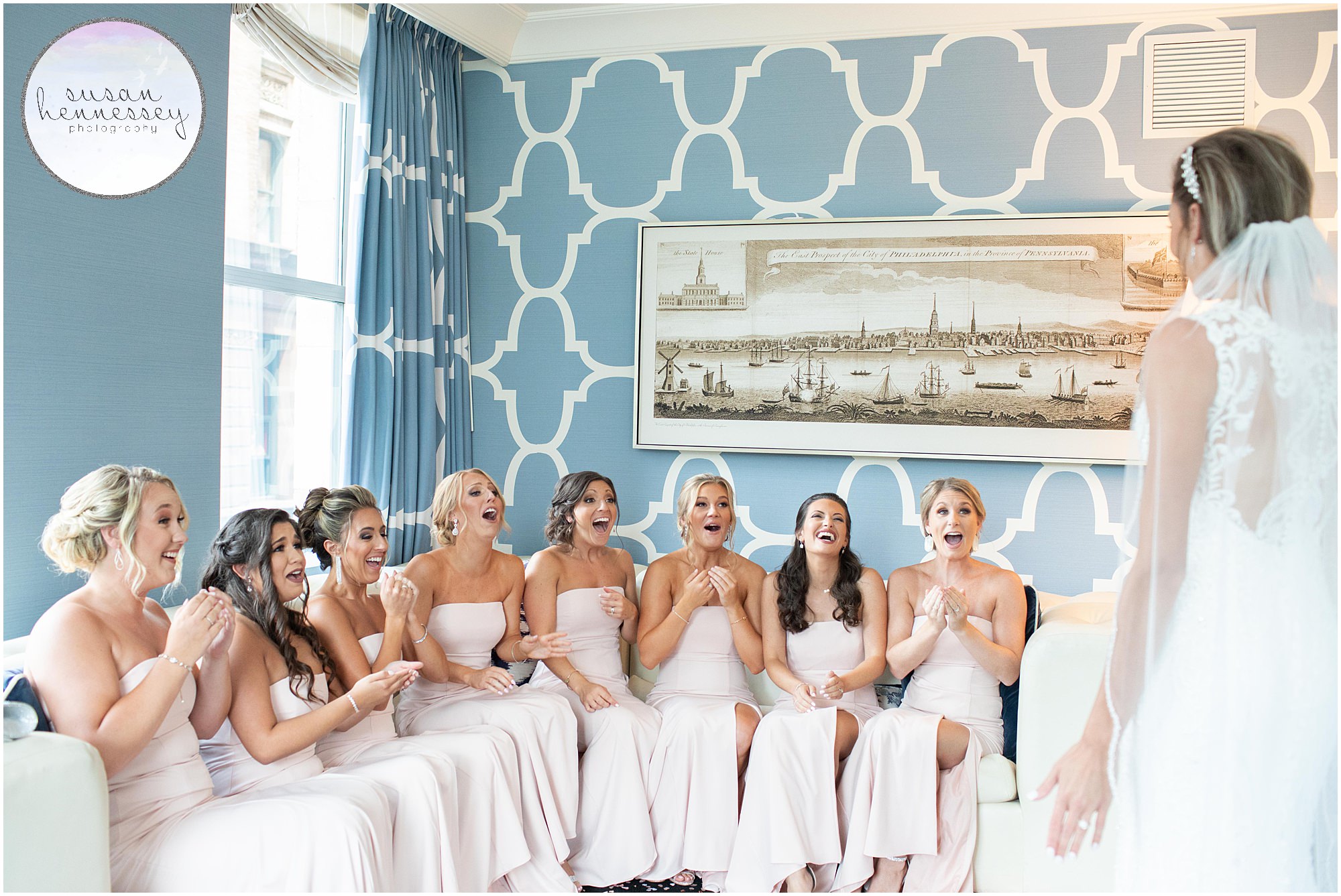 Bride has first look with bridesmaids at Hotel Monaco.