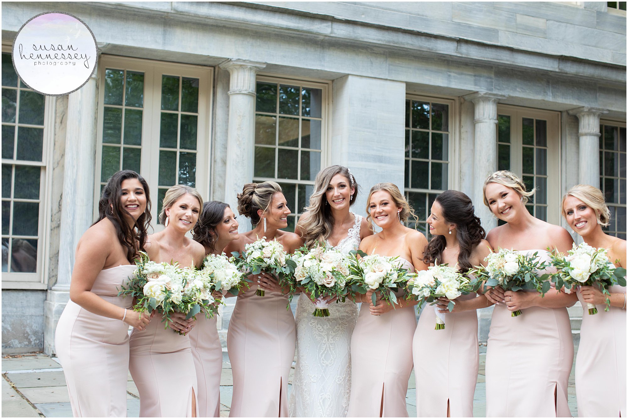 Bridesmaids in pink at merchant exchange building at Union Trust wedding.