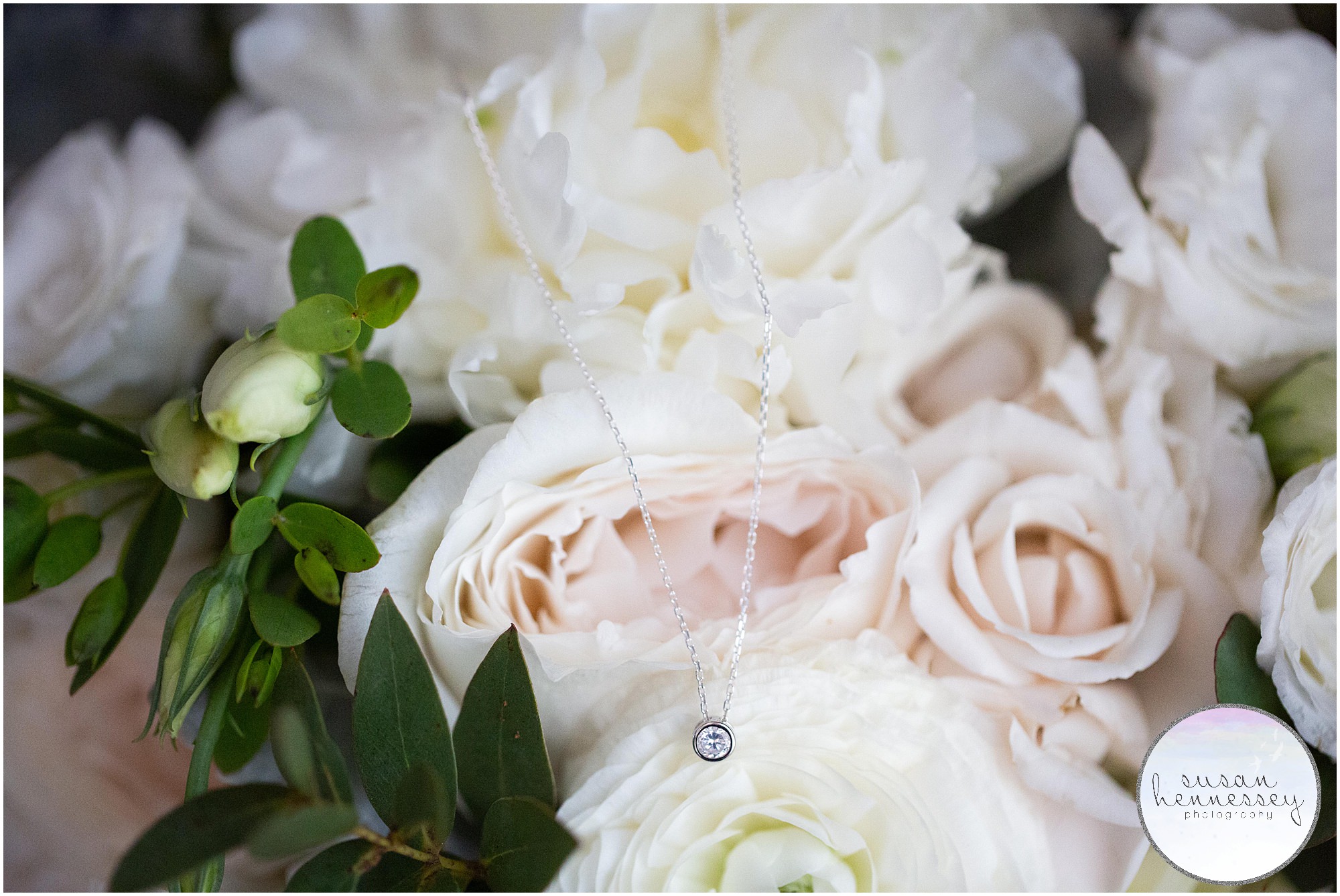 Bride's necklace on bouquet.