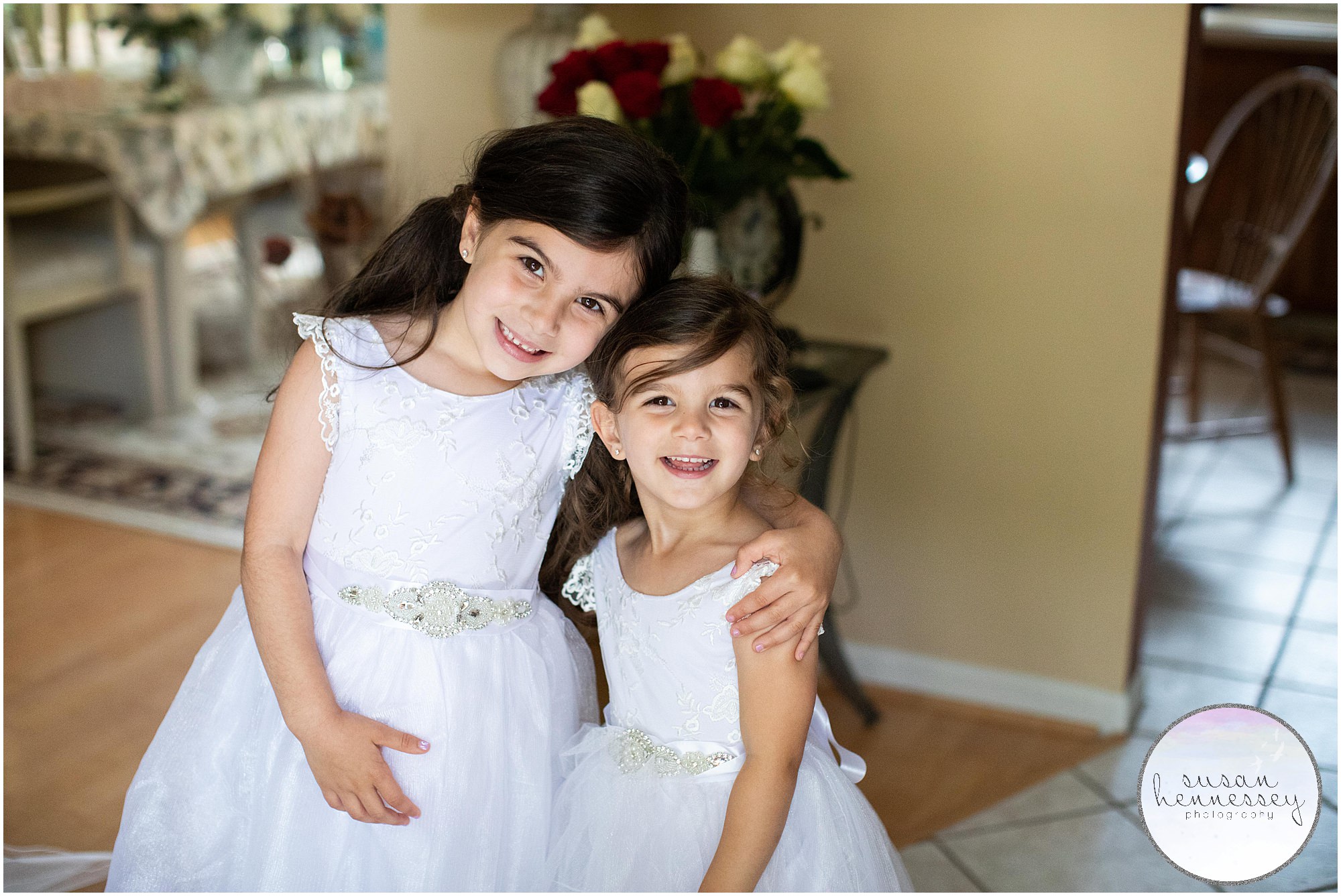 Happy flower girls smiling on the wedding day