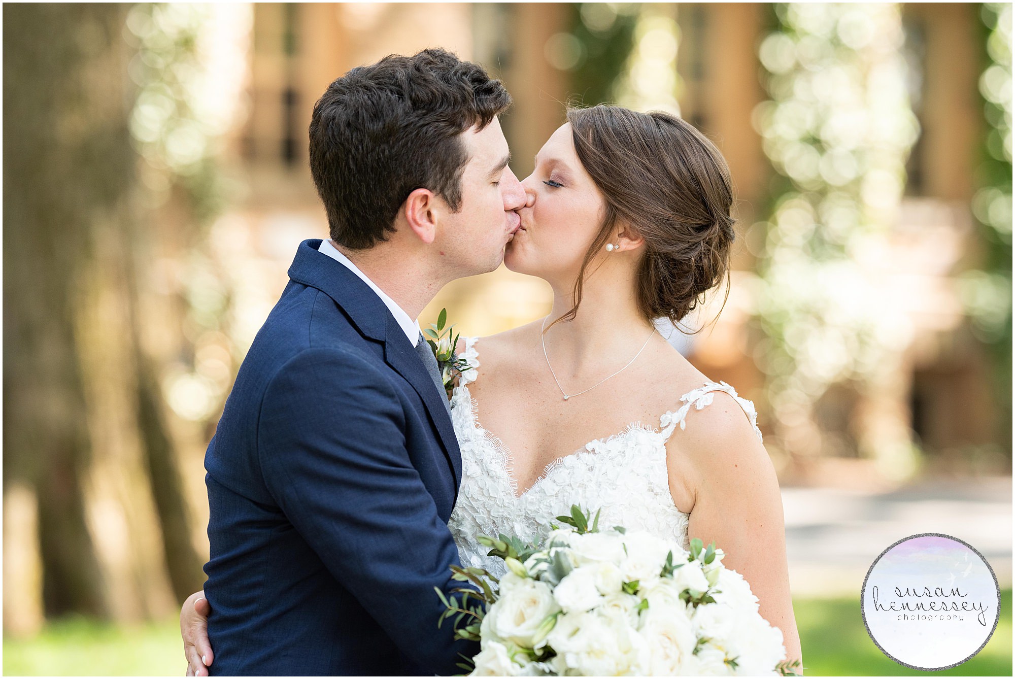 A bride and groom kiss on their wedding day